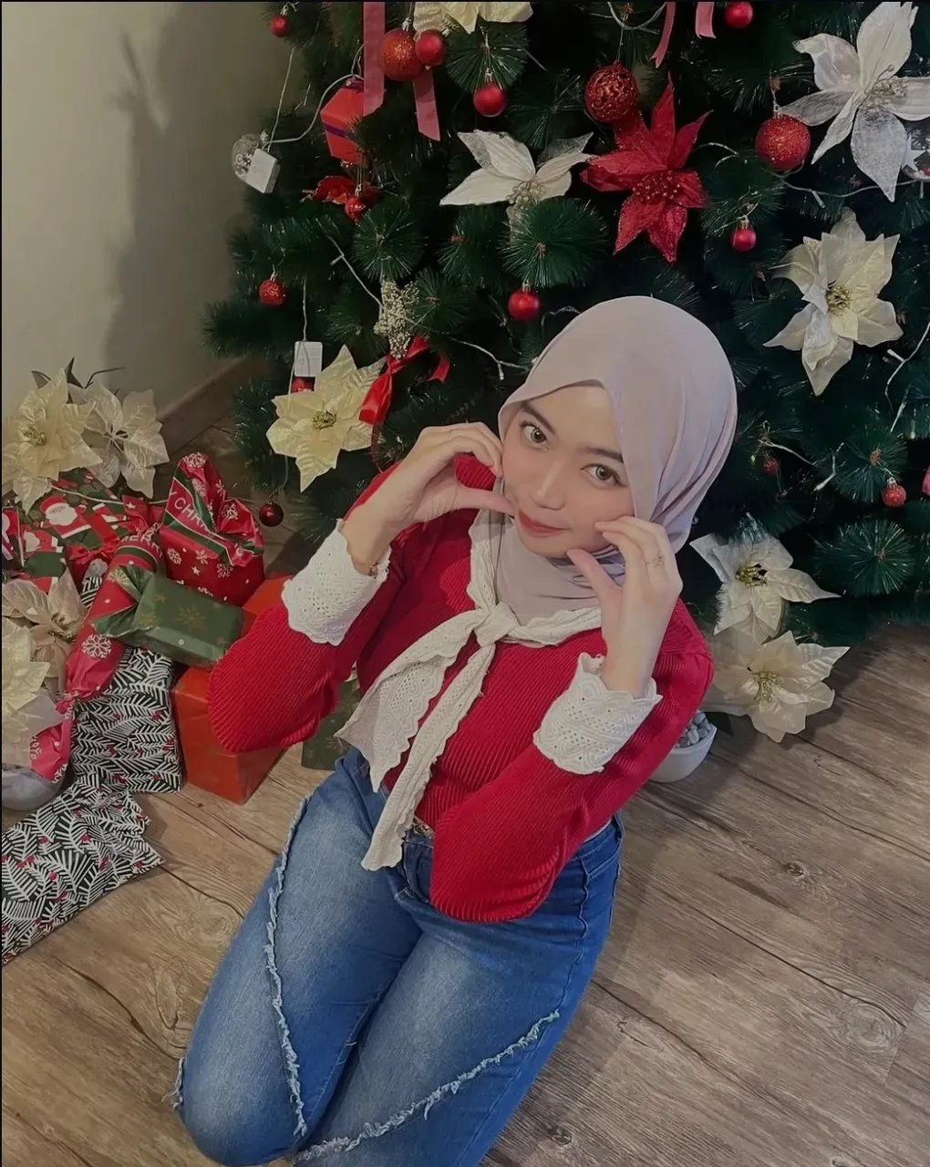 masterpiece, best quality, ultra-detailed, illustration, hijab, 1girl, looking at viewer, best quality,depth of field,(closed mouth,light smile,blue eyes:1.1),beautiful detailed glow , (santa costume:1.3),(hands behind back:1.3),(arms behind back:1.3),blaze (arknights),   