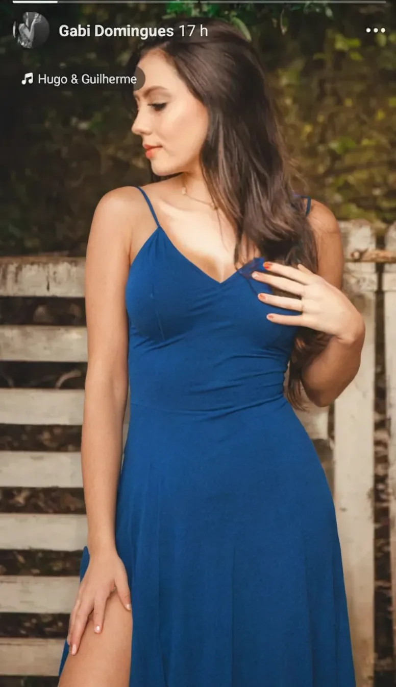 create a hyper realistic vertical photo of [[North Indian ]]most attractive woman in her 40s, blue color Sundress, extra big chest, 36d, flirty gaze, Feathered Bob , trending on artstation, portrait, digital art, modern, sleek, highly detailed, formal, determined, pink liner lipstick, soft lips, black eyes