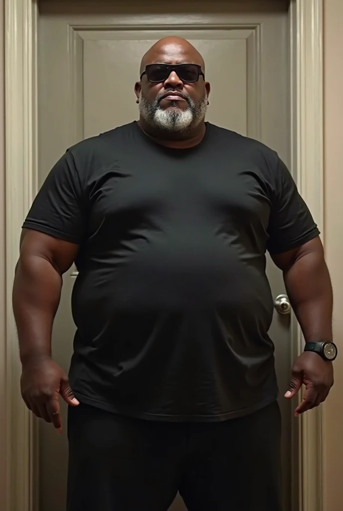 (8K Graphic Art) (fondo de un pasillo estrecho) sexy: Un solo hombre africano calvo sin pelo, cacheton gigante, obeso, muy barrigon, serio, 60 year old grumpy 35 meter tall bodyguard with a huge belly, corpulento de barriga con una forma redonda con un cuerpo obeso completo, standing in a hallway with a huge distended belly sticking out to the side like a huge beach ball, usando una camisa blanca uniforme, Long pants, gafas de sol con vientre enorme globo hinchado de 800 libras pesado lleno de mucha cerveza con una enorme barriga colgando entre sus rodillas, with his arms supporting his stomach