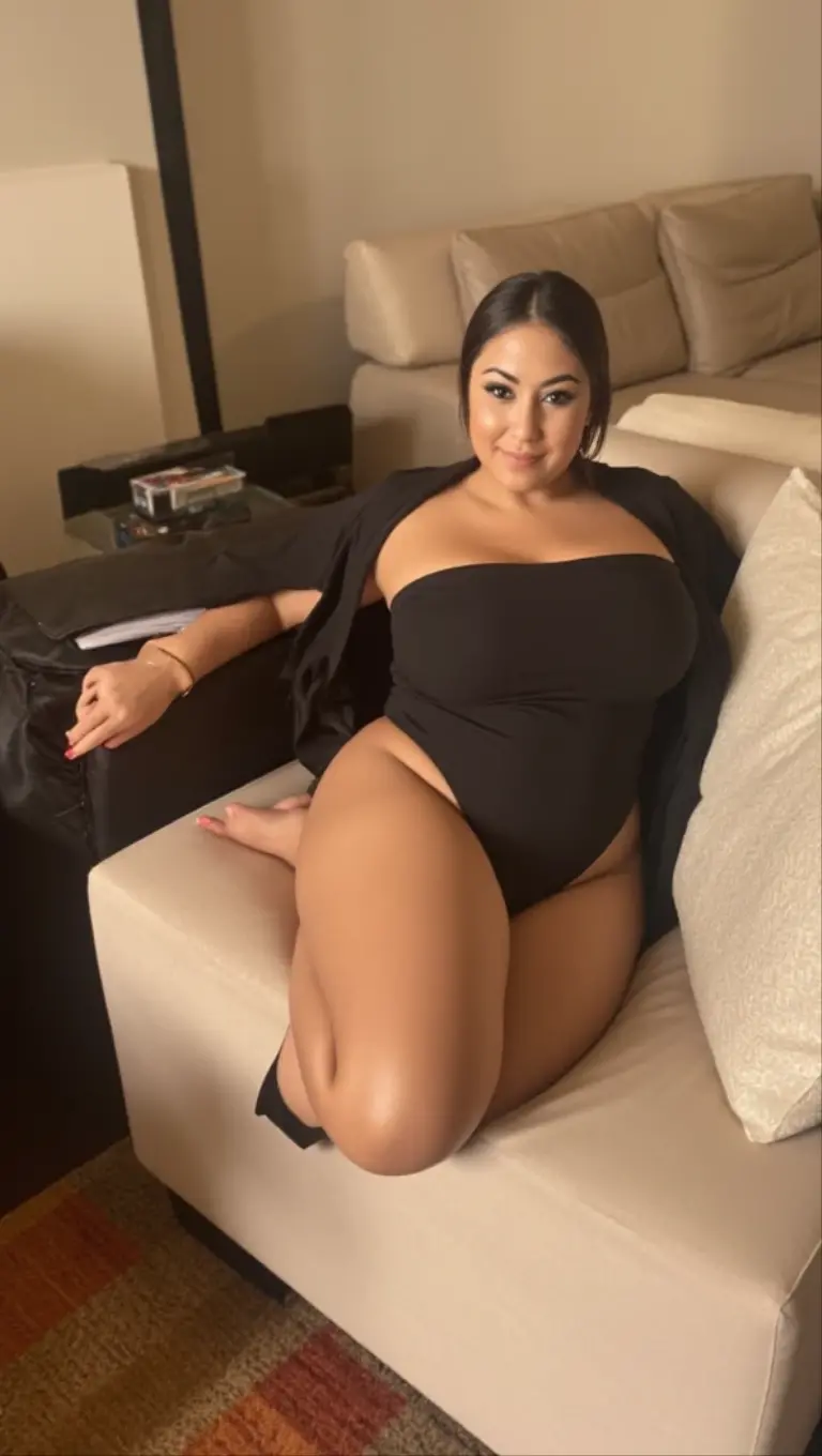 Latina woman, brown long hair, size 10. Curvy body