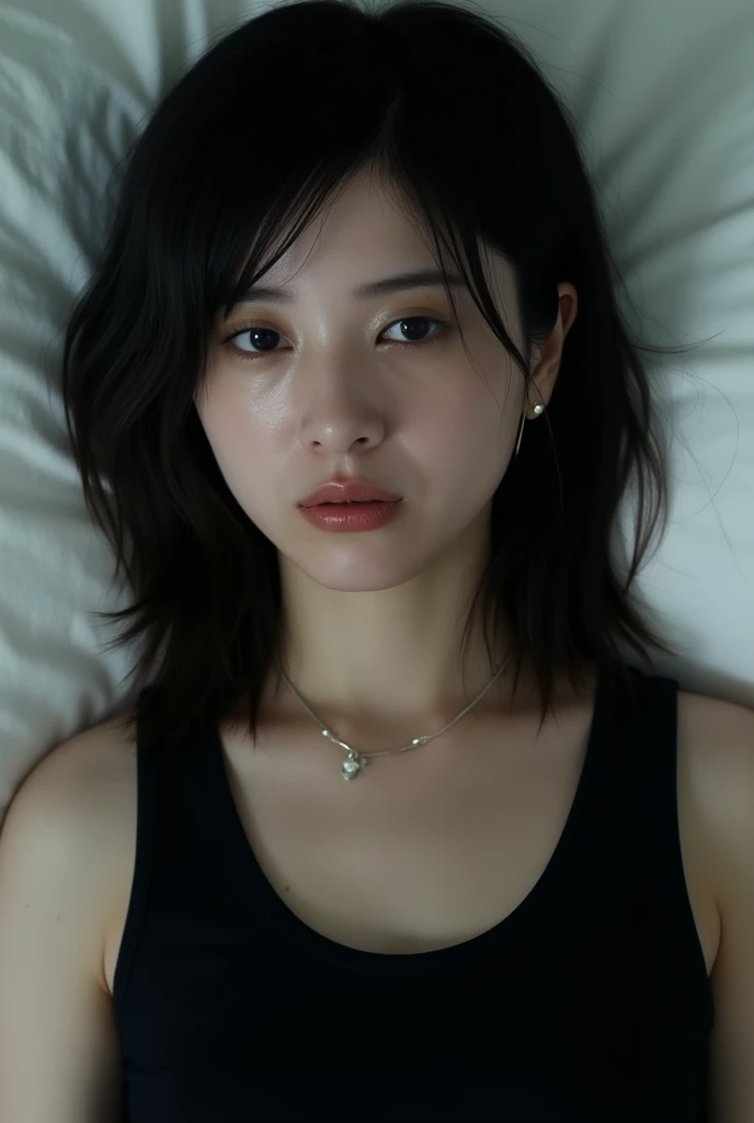 A middle-aged Japanese person sitting on a sofa, holding their lower back with a pained expression on their face, representing physical discomfort caused by stress and fatigue from daily life. The person should have typical East Asian facial features and look tired and tense, with hints of a Japanese-style living room or home office in the background to convey the idea of work-related stress affecting their physical well-being.