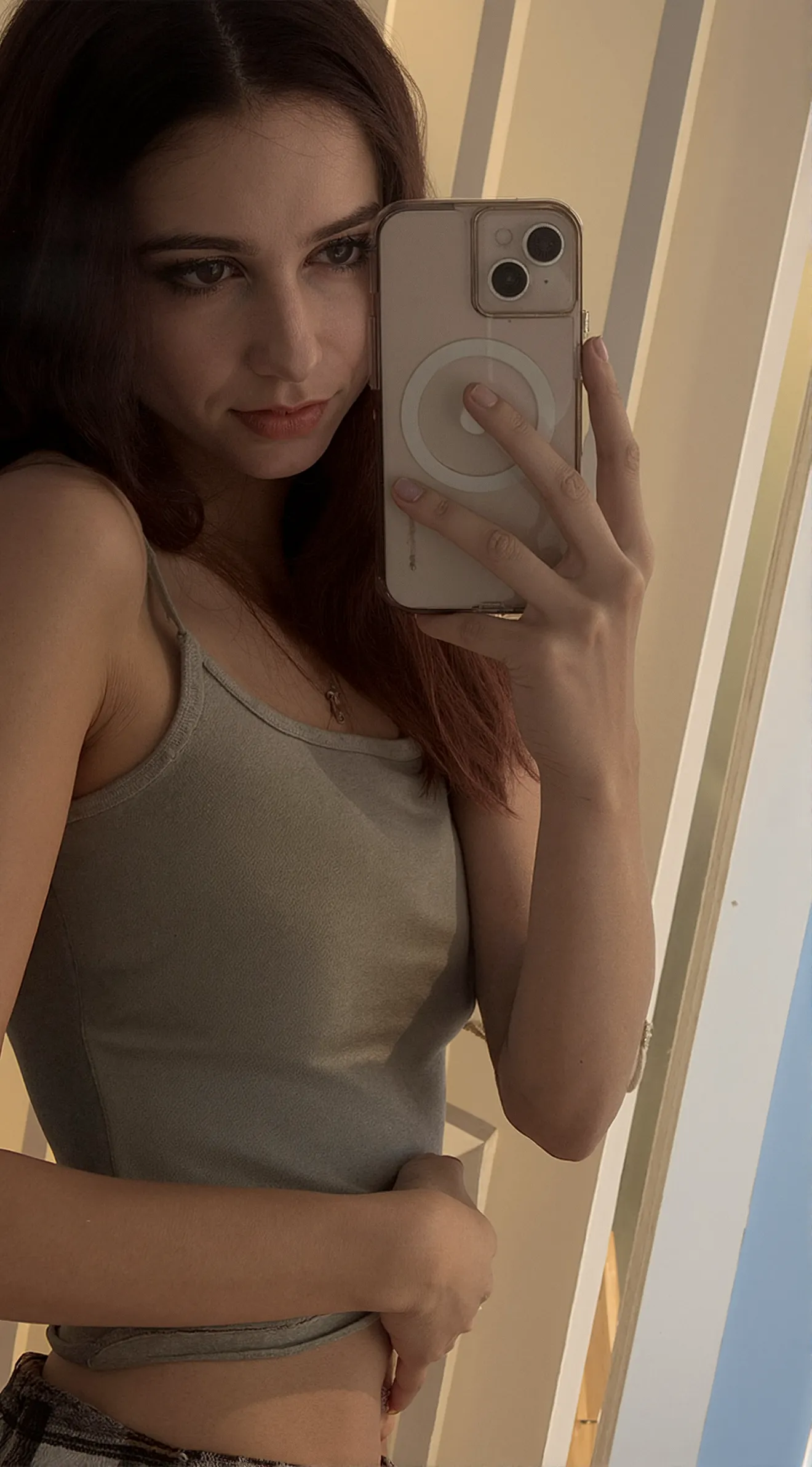 (High resolution, 8K, very detailed, beautiful detail eyes, best quality and masterpiece), detailed face, solo, 1 girl, white wavy hair on chair, heterochromic eyes, small moles under the eyes, short skirt, medium breasts, long legs, tightened abs, (camel toe), (no panties), (no bra), sitting position