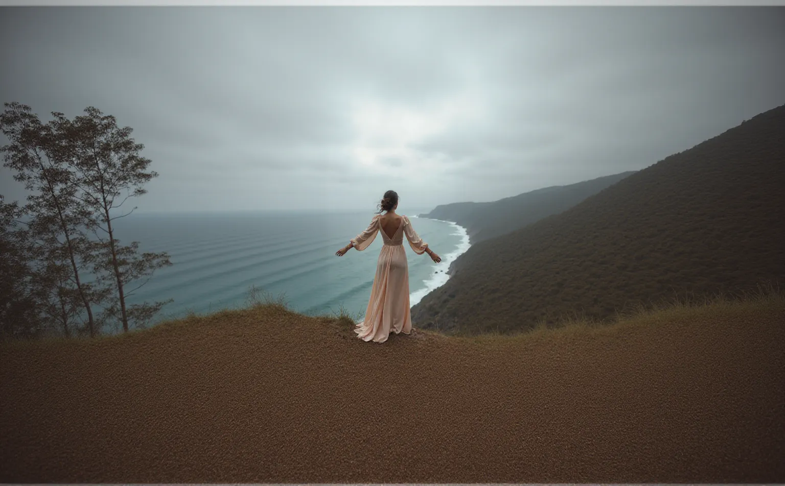 Photoshot of a beautiful woman wearing a unique dress dancing on the edge of the rocks on the edge of a beautiful beach and there is a sign with the name Ridwangrapher