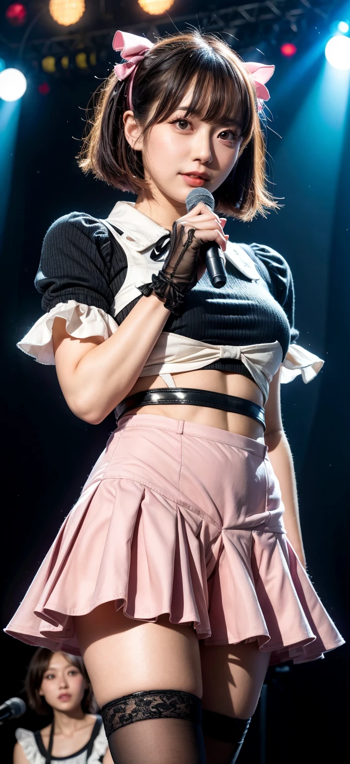 Hayley Williams wearing a low-cut corset and short skirt and smiling
