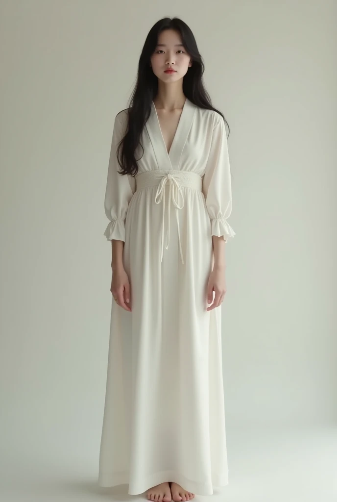 Long white cotton maxi dress cut half sleeves with silver pump heels and small handbag