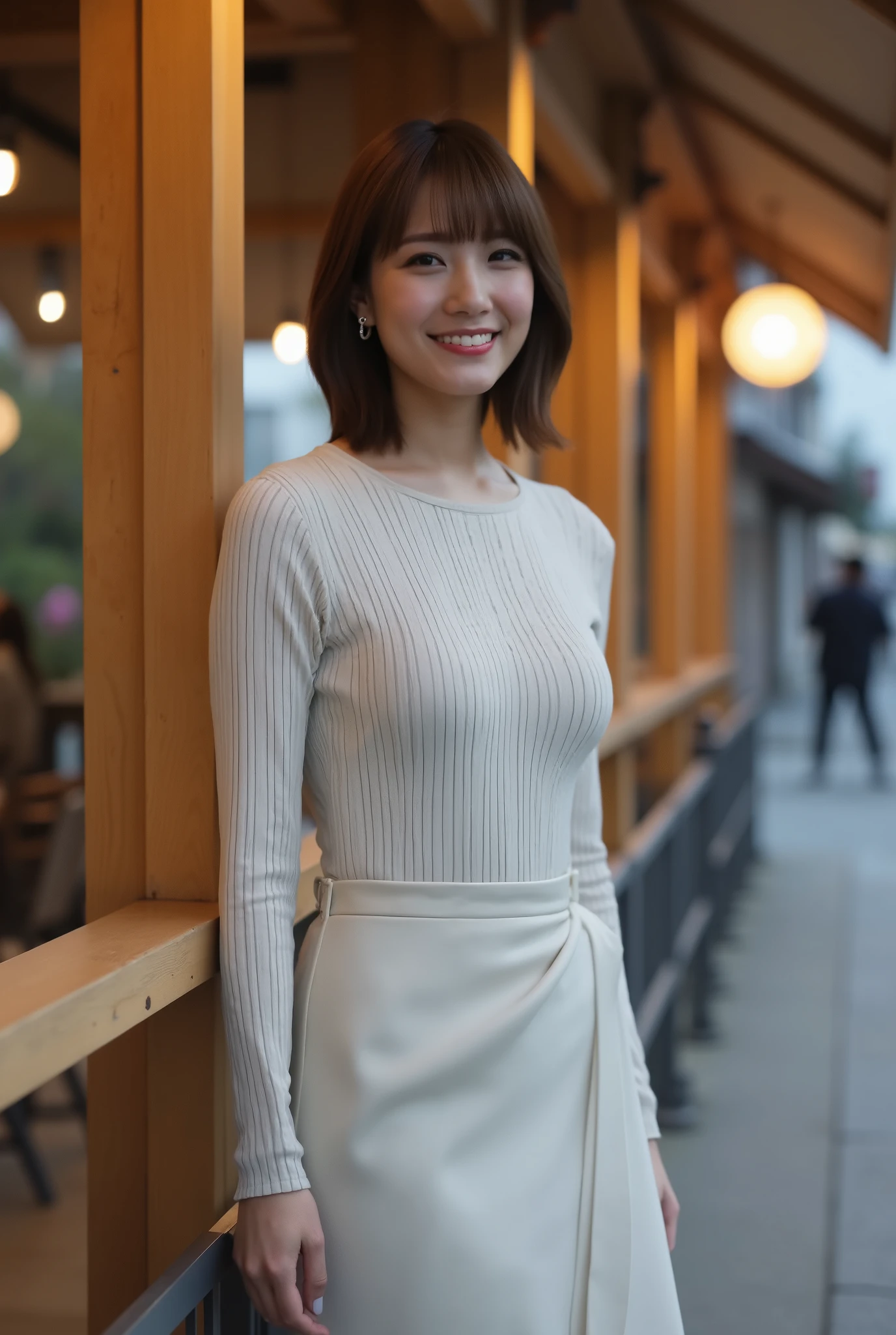 A fashionable and feminine Japanese woman with short hair, standing in front of a modern sidewalk café with wooden accents and soft lighting, wearing a fitted boat-neck long sleeve top and a wrap-style midi skirt with asymmetric hemline, framed from head to thighs (medium long shot), slightly leaning against a railing, smiling faintly with a relaxed elegance, warm ambient lighting from the café, subtle street reflections on the pavement, photorealistic, ultra high resolution, 8K UHD, soft shadows, beautifully styled urban fashion, masterpiece, best quality