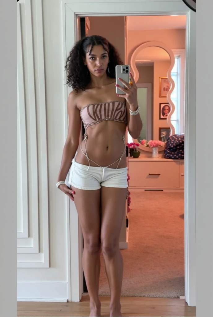 Woman with big curly blonde hair taking a photo of herself in a mirror Instagram photo style with an iphone 14