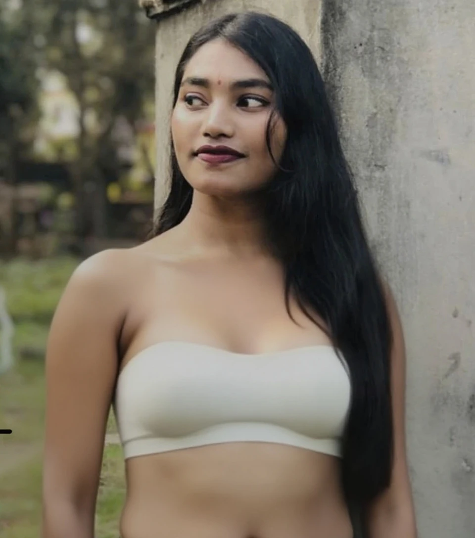 a beautiful Indian lady, 22 year, attractive, pretty, good looking, excellent , superb , wearing bra with high-waisted shorts, earrings, arched back, sunlight, public park background, 8k, intricately detailed, UHD,
