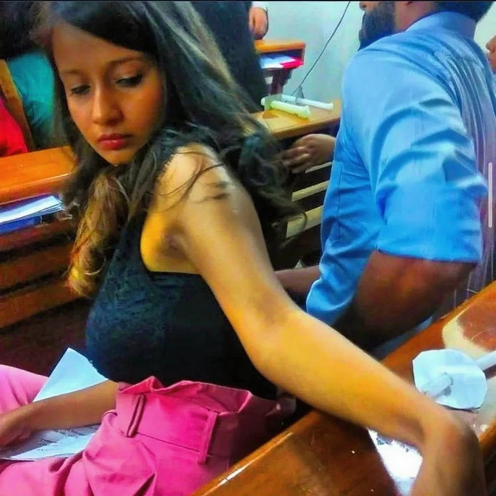 female teacher and male student, in class, in close position