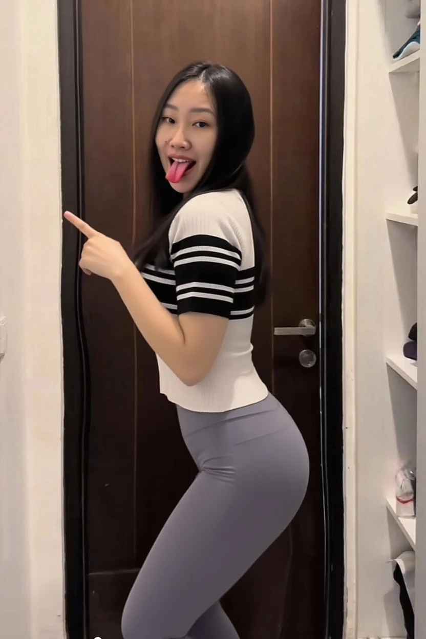 a close up of a woman in a black shirt and shorts, she is dancing, she is dancing. realistic, she has a jiggly fat round belly, sexy look, tiktok video, thicc, sexy girl wearing shorts, sexy body, sexy hot body, attractive pose, sexy black shorts, she is posing, pretty face with arms and legs.ultra HD.high resolusi