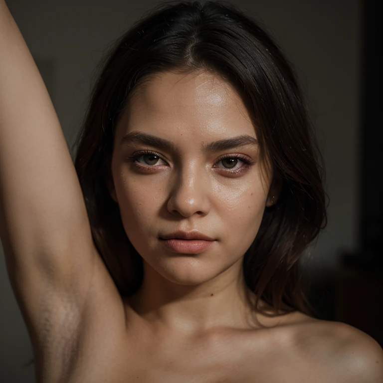 A woman raises one hand and shows her armpit