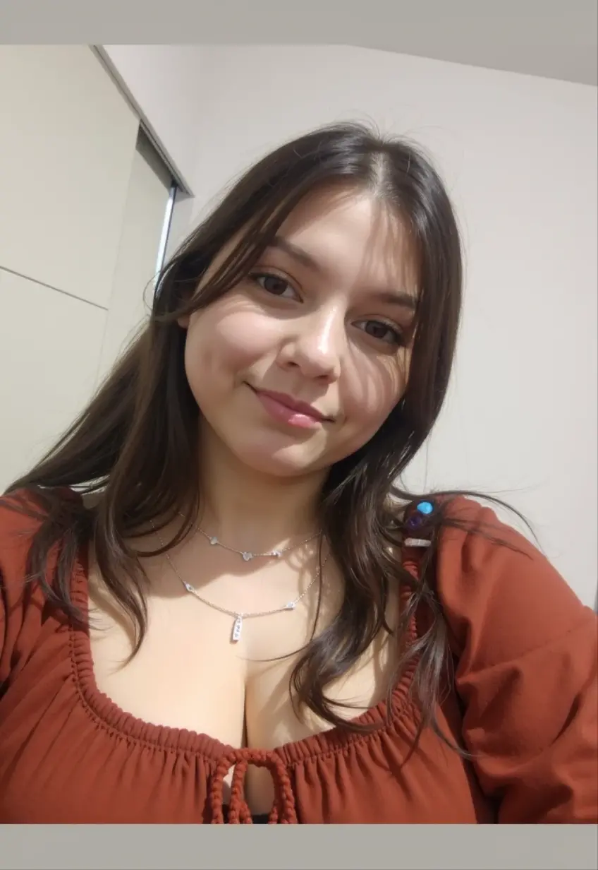 A close-up shot of a Cuban woman in her mid-30s, standing in front of an Instagram screen on her phone. She's surrounded by vibrant decorations, including balloons and confetti. Her expression is a mix of sadness , disgust , love and excitement . Her 25-year-old self is reflected in the phone screen, showcasing a defined beauty with luscious hair and captivating eyes.