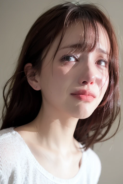 Woman looking down, with a worried face.