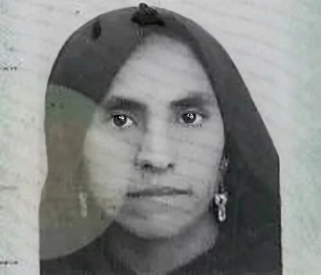 Make this photo look realistic and detailed, there is a woman with a white head scarf and a blue shirt, photo of a woman,50-year-old woman from indonesia, woman portrait, full face portrait, realistic restored face, photographic portrait, photo of a black woman, portait image, portrait of a 50 years old women, portrait of woman's face, very detailed potrait, realistic portrait photo, close up potrait, profile portrait, very detailed face, very realistic face, very perfected face, very detailed clothes, very realistic clothes, very perfected clothes