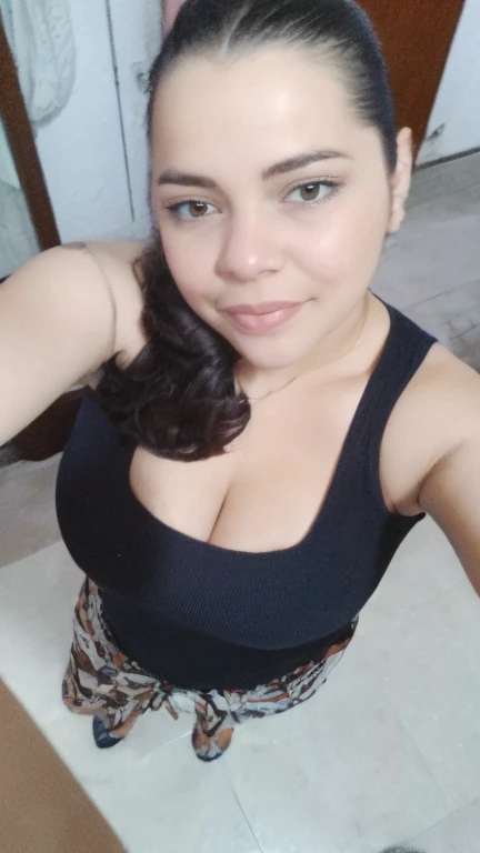a close-up of a woman taking a selfie in a room, angelawhite, 30-year-old woman from cuba, looks like fabiula natal, 1614572159, lorena avarez, ela tem cerca de 20 anos, she is about 2 5 years old, she is about 2 0 years old