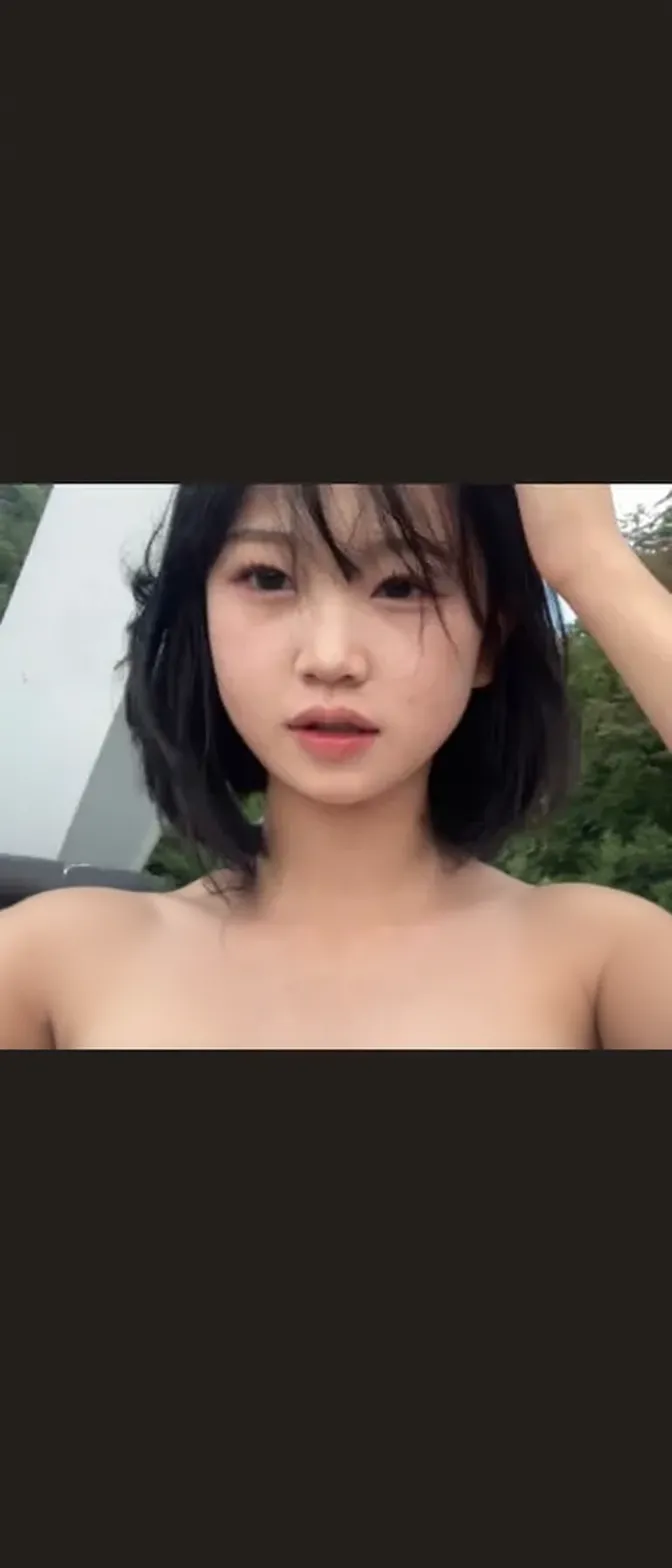 Asian naked women, wet bodies, bathing in a shower, in the open, standing with hands raised behind their heads, legs open, surrounded by graffiti walls, three beautiful women, naked breasts and vaginas visible, from the front, perfect distance view