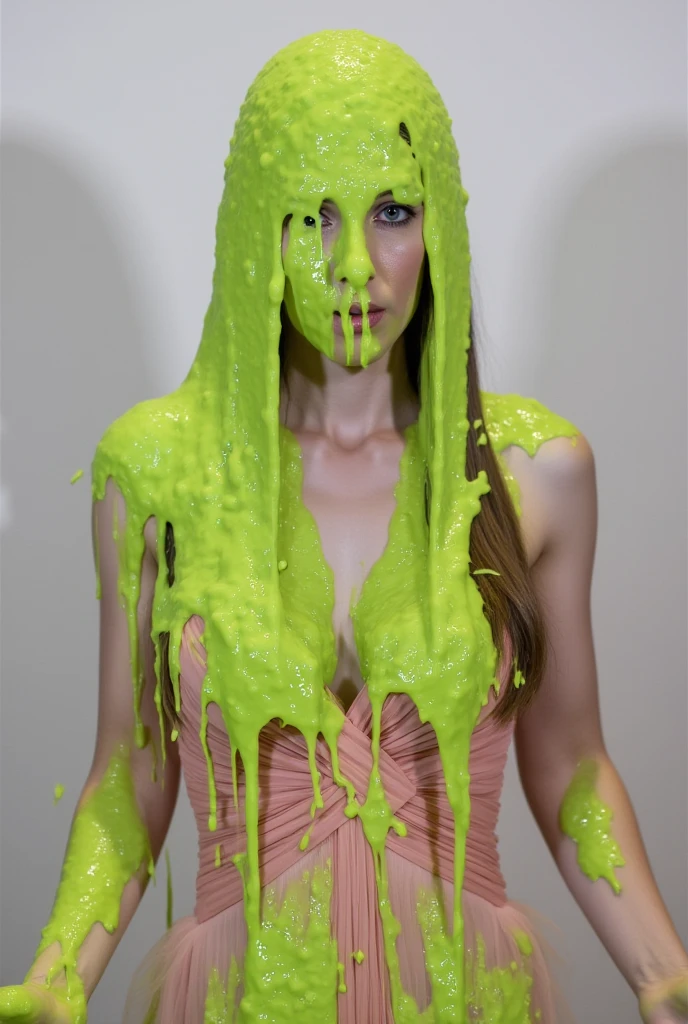 color photo by walter iooss jr of a 2010s tv scene featuring a spunky 19yo woman seen from the waist up with green oatmeal goo ENTIRELY covering her hair and closed eyes. it pours out from high above in a stream, spattering chaotically with motion blur. the same substance slimes her strapless dress and her arms as she holds them out, in a graceful posture, as she laughs helplessly. white background, low light, film grain. the scene captures a fun and surprising mood.
