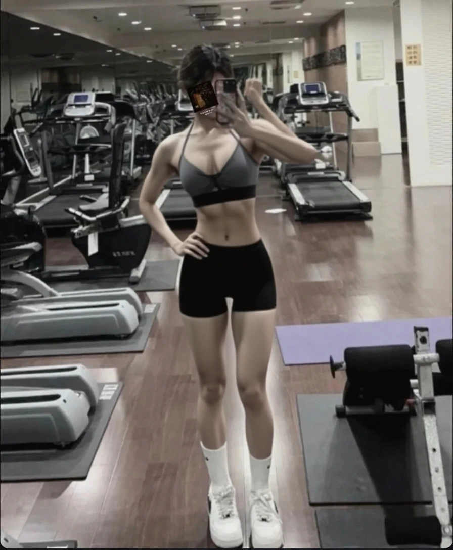 1girl, (Black Eyes), (smiling), light makeup, wide hips, Big tits, big ass, (thin waist: 1.2), (thick and toned thighs), (Best Quality, 8k, Masterpiece: 1.3), Clear Focus: 1.2, Perfect Body Beauty: 1.4, strong abs, Highly detailed face and skin texture, detailed eyes, double eyelids, red lips, (black short hair :1.2), (black sports top :1.2), (red sports panties :1.2), standing, dynamic pose, in a gym, exercise machines in the background