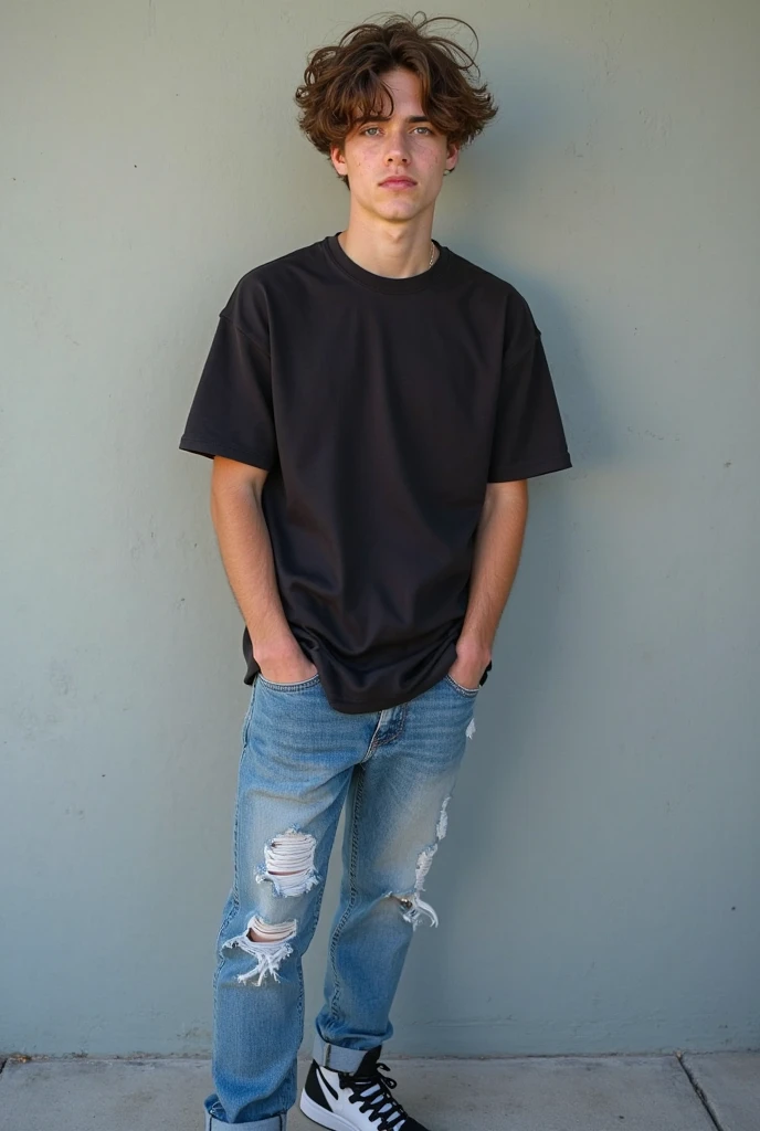  male teenager with dark skin and short, semi-wavy black hair wearing a black t-shirt, worn blue jeans, and blue and black tennis shoes
 
