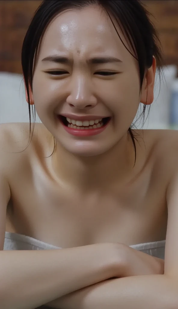 A naked Japanese girl has an ecstatic expression as a milking machine touches her breasts