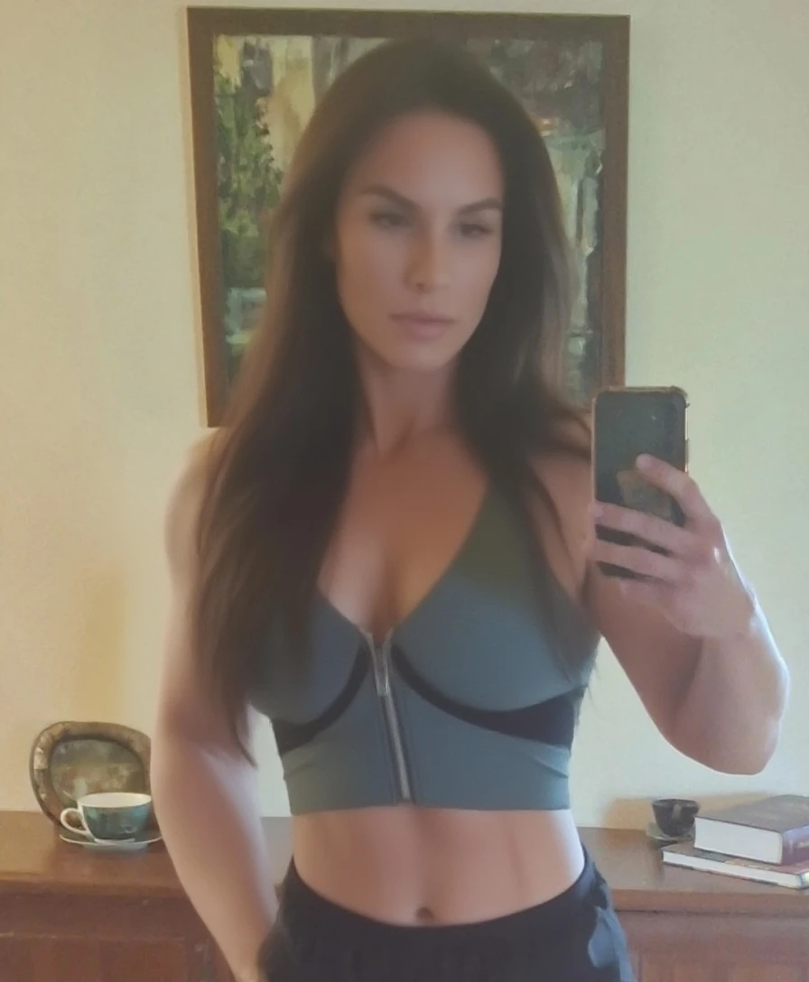 Sandra Bullock dressed in a low-cut shirt with lycra shorts