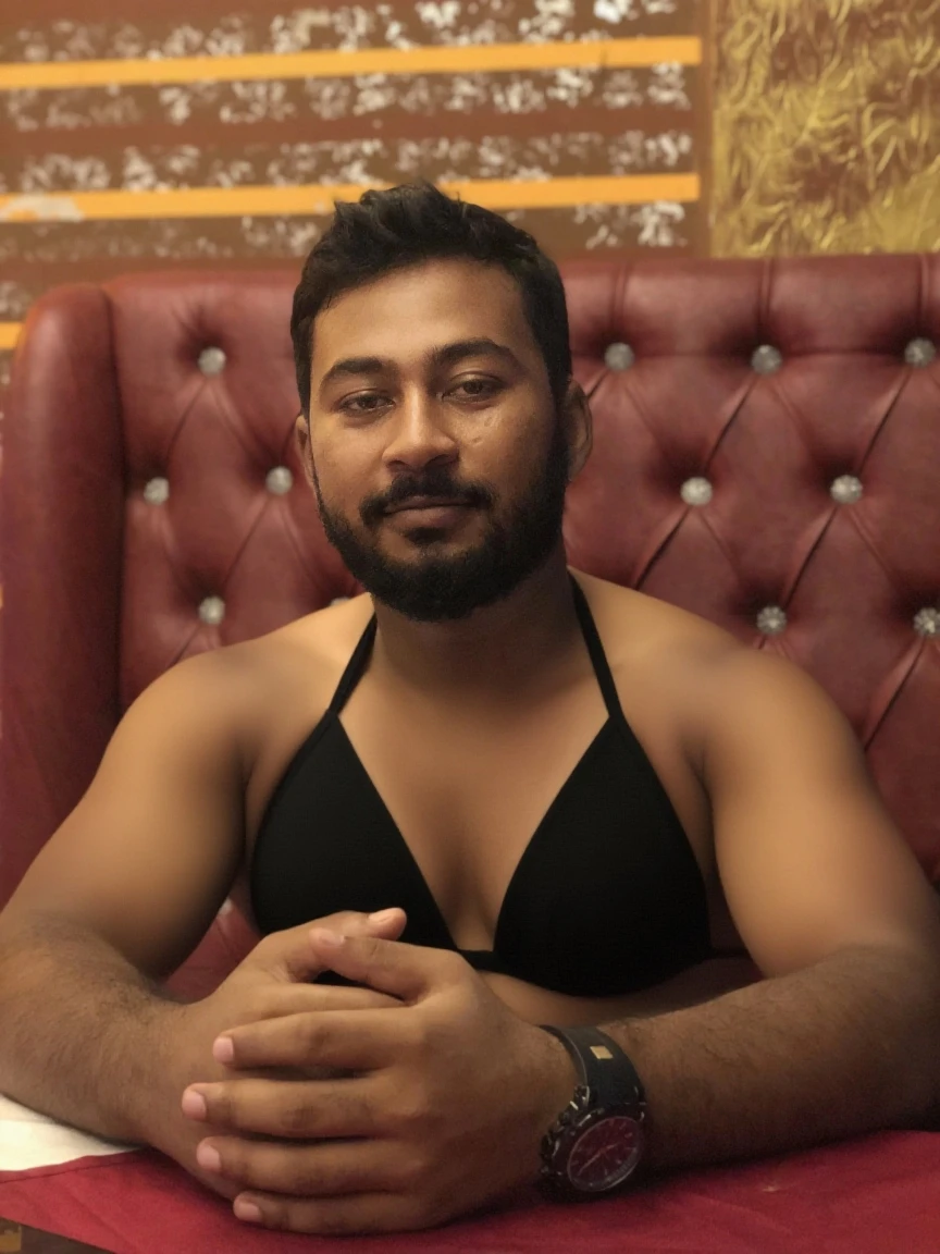 A sexy indian man, nsfw, homoerotic, sitting on a chair, black hair, headphones, , Surrealism, 8k, super detail,handsome face,penis,cinematic lighting,ultraHD, masterpiece, 16k resolution,cleavage ,shirt, saddened expression 