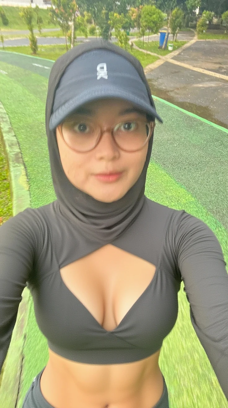 arafed woman in a helmet and a black and gray top, big breast