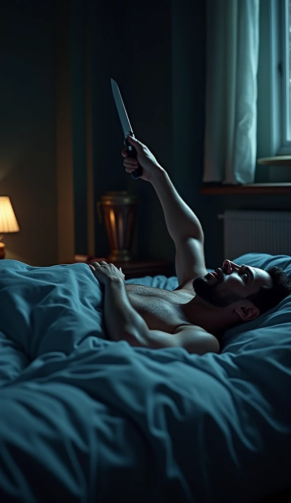 man crying with cell phone in hand and lying on a bed, black wall background, elegant black bed blanket