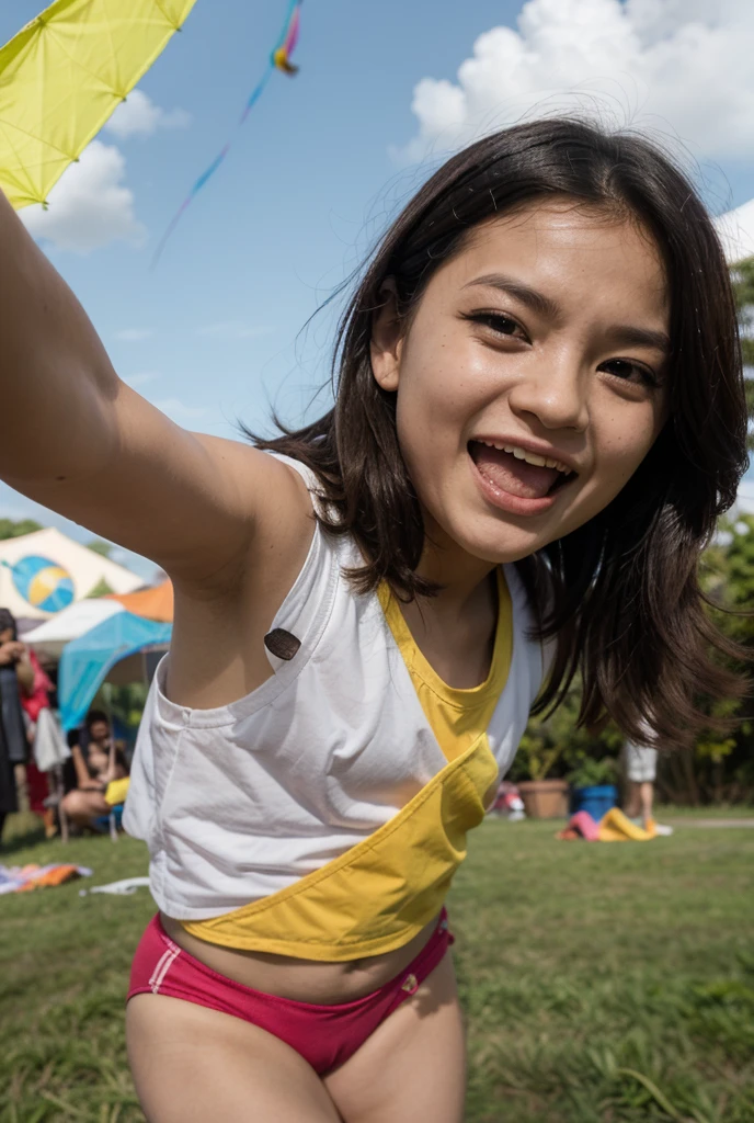 a young woman with long dark hair, with short straight bangs, She has a nose ring and lots of tattoos. She is sitting on a chair wearing a multi-colored t-shirt and has a box of paints and brushes next to her.. Children, excited, They are in line waiting for their turn. The woman is smiling as she paints a smiley face on the cheek of one of the children sitting in front of her, with his gaze fixed on the brush and the paint. 