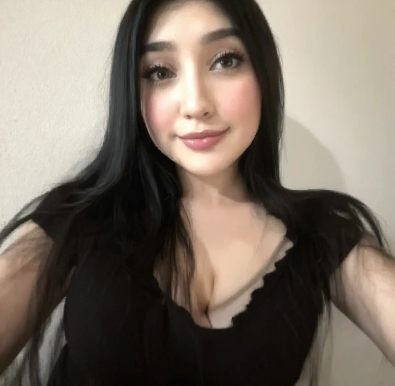 A selfie of a girl with long black hair