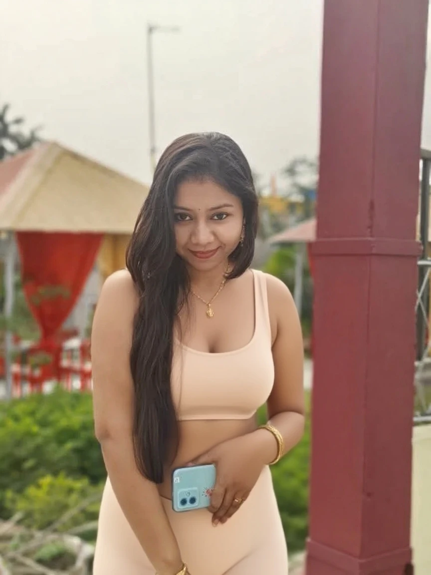 Hot young Indian woman wearing a loose shirt buttons open, no bra, sitting near a water falls seeing the sky, beautiful face, clear face, beautiful eyes, curvy structure, medium breasts, cleavage. wearing a wet shirt.