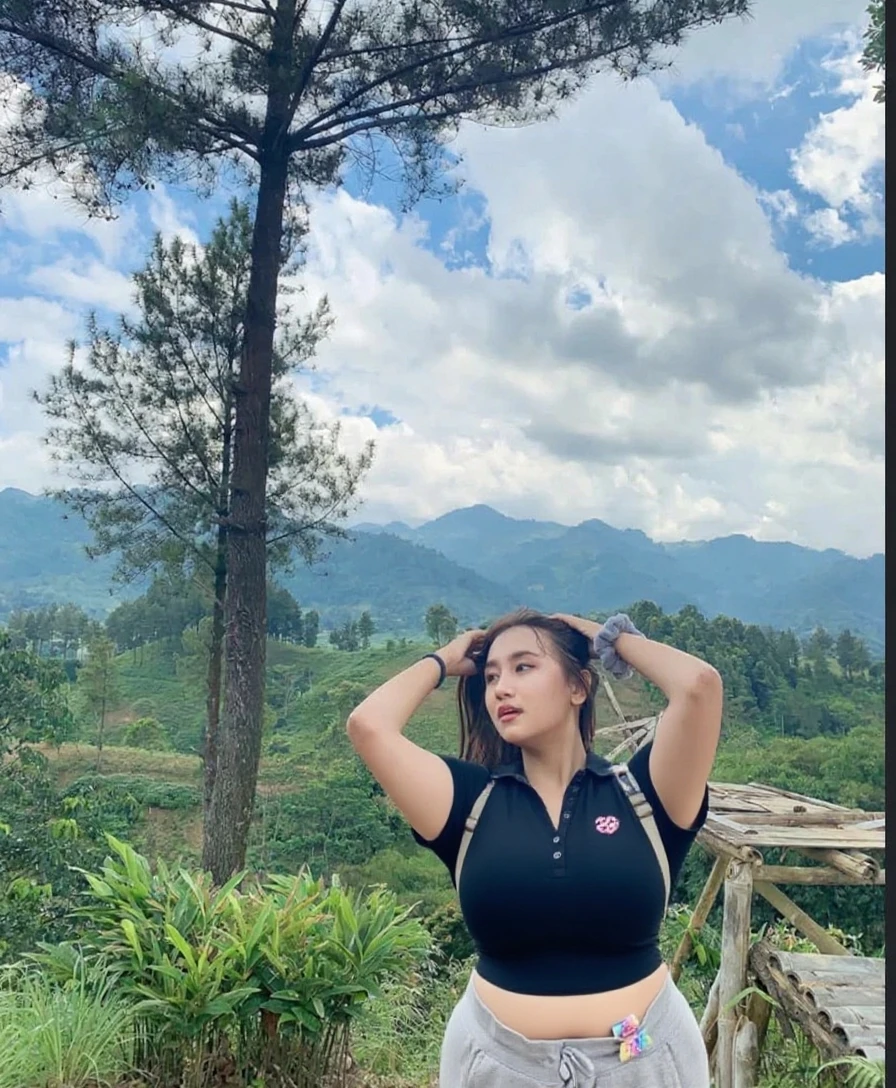 araffe woman in a tight shorts and a green tight tshirt posing for a picture, in front of a forest background, cottagecore!! fitness body, view from back, from side, with backdrop of natural light, with long hair, 4k post, 4 k post, 😭 🤮 💕 🎀, 🐎🍑, view from the back