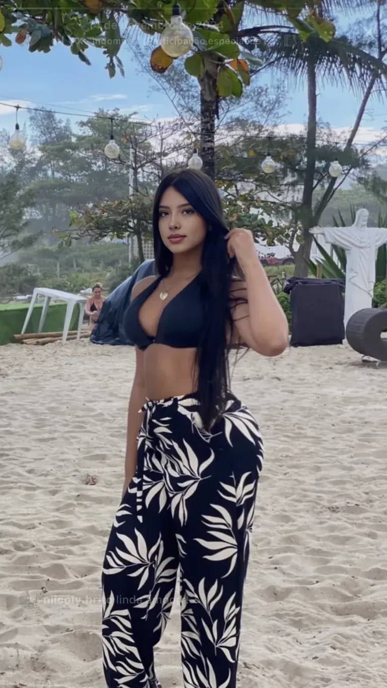 ((Realistic lighting, Best quality, 8K, Masterpiece: 1.3)), Clear focus: 1.2, 1girl, Perfect Figure: 1.4, Slim Abs: 1.1, ((Dark brown hair)), (White crop top: 1.4), (Outdoor, Night: 1.1), City streets, Super fine face, Fine eyes, Double eyelids,