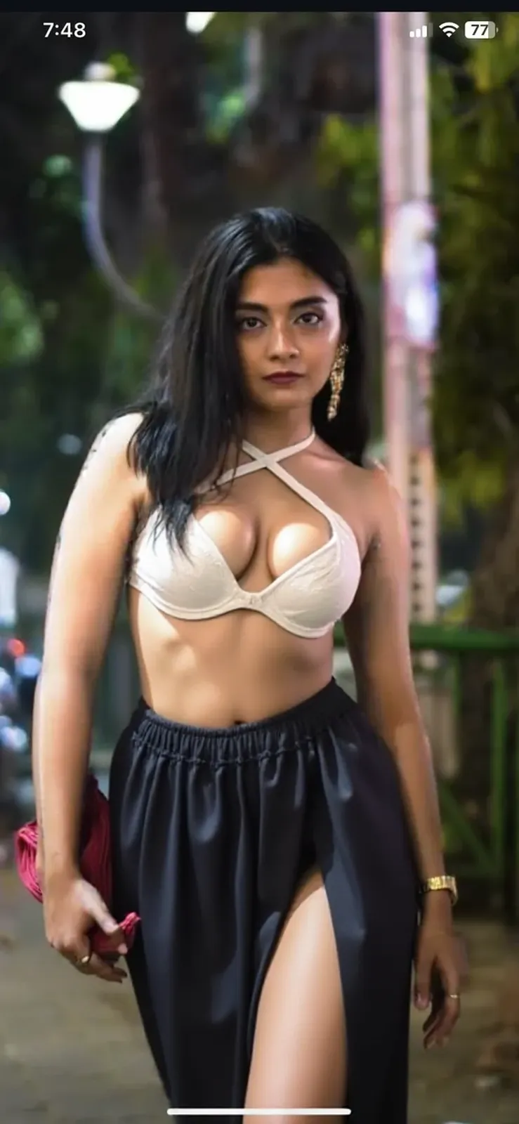 A hot young Indian girl, standing in a mountain region wearing a black transparent bra and a leather hat, buttons open, cleavage, big boobs, very beautiful face, brown eyes, curvy body, (clearly detailed picture), (high definition). 
