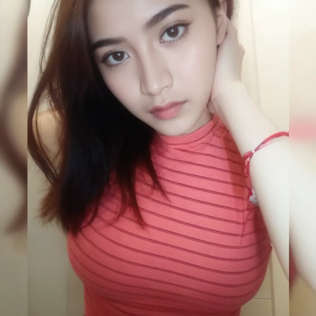 there is a woman sitting on a bed with a cell phone, south east asian with round face, photo of the girl, portrait of modern darna, photo of a woman, with very thin lips, with round face, potrait, face picture, close up potrait, with accurate face, taken with sony alpha 9, picture, with short hair, big bobs, bobs, perfect breast, perfect bobs, a women no bra, no bra, Nipple, a transparant t-shirt, transparant dress, No Bra, 1 girl with no bra, full body, transparant body, nipples, no bra, no bra, perfect bobs,