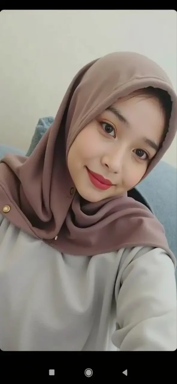 RAW photo of a 24 year old girl wearing hijab,((smile)), satin abaya sexy sea foam , satin, hijab face portrait,((tp background)), 8k uhd, dslr, soft lighting, high quality, film grain, Fujifilm XT3, covered dress, patterned dress, gigantic breasts:1.5 , ((HD))