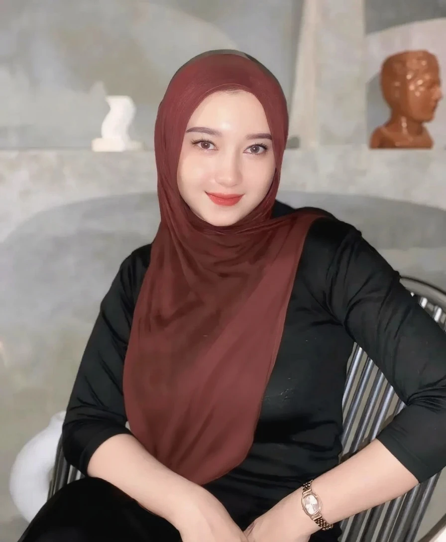 RAW photo of a 24 year old girl wearing hijab, satin abaya sexy sea foam , satin, hijab face portrait,((tp background)), 8k uhd, dslr, soft lighting, high quality, film grain, Fujifilm XT3, covered dress, patterned dress, gigantic breasts:1.5