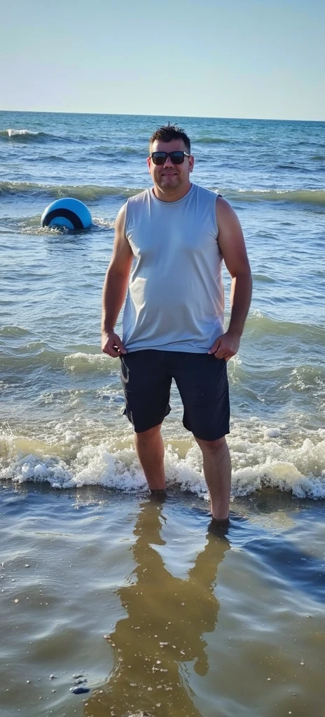 there is a man standing on the beach with a red swim suit, wearing black sunglasses, 3 2 years old, standing at the beach, wearing red swim shorts, dad bod, body of a dad