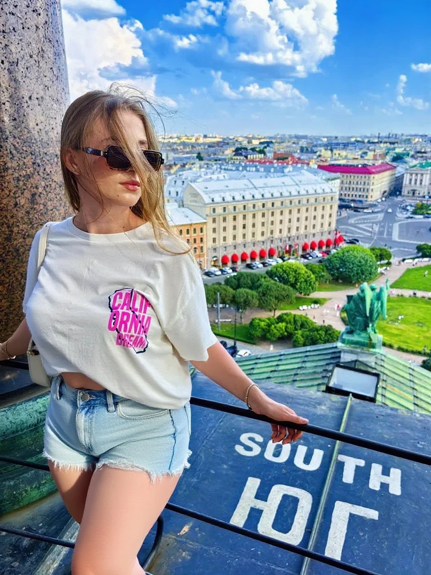 asian woman, blond short hair, blur eyes, 24 years old, smile, posing on the Moscow city background, morning view, wearing t-shirt and shorts