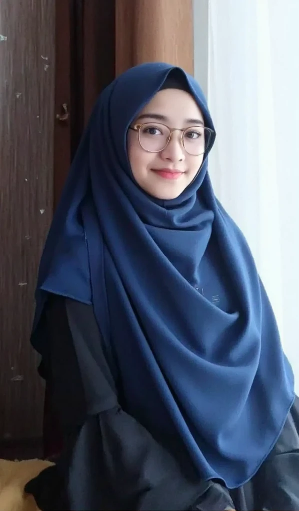 adorable, 1 girl, (face to face), 10 years old, baby face, happy, half body portrait, (face details: 1), (eye details: 1), ((big breasts)). wearing transparent softblue long shirt, hijab, .. Cute posed. proportional body. Ultra High Res. realistic: 1.4, UHD, (floral pattern)