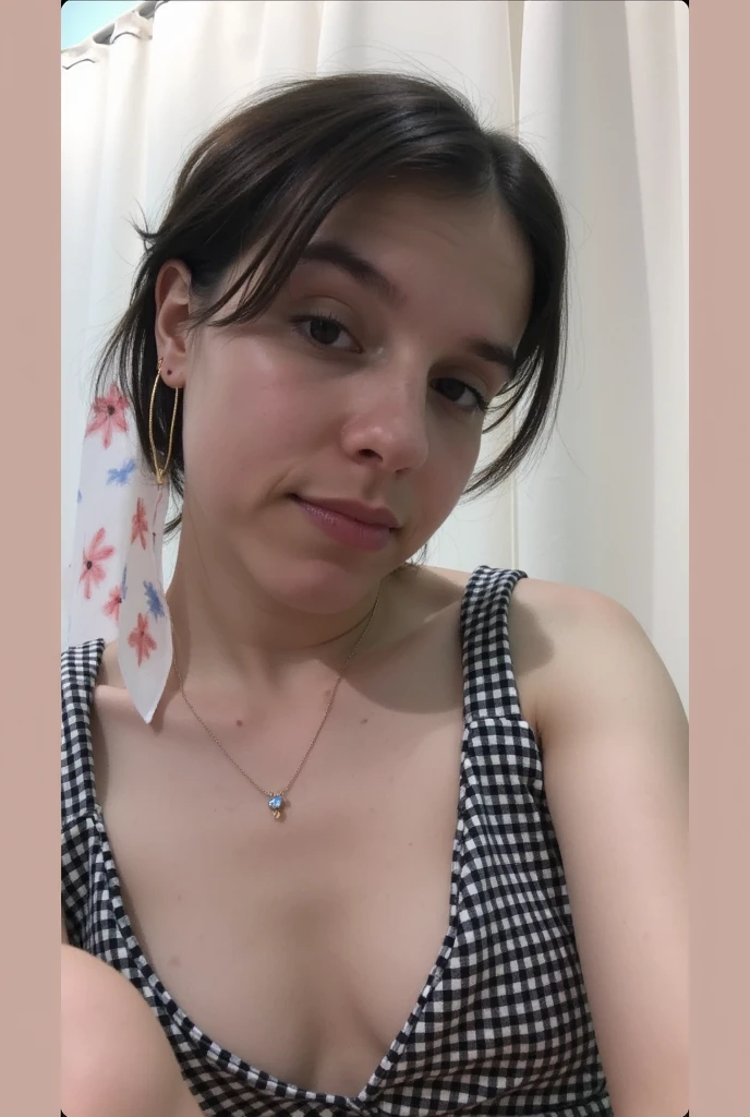 She is taking a selfie, just wearing a thong, showing her ass