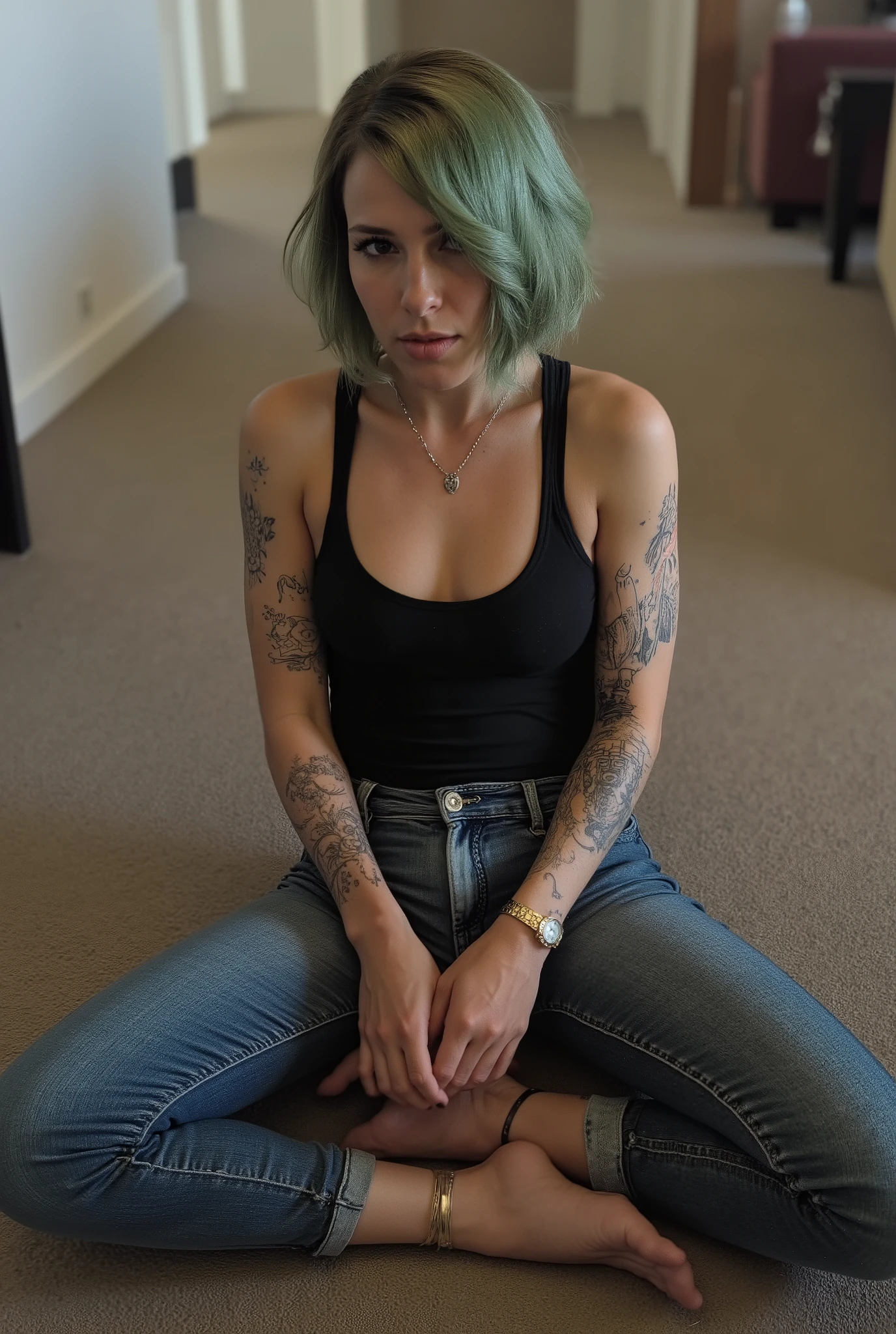 Revealing the outlines of an  , skinny femboy in tight jeans sitting with spead legs on floor in front of viewer, youthful androgynous figure, flat  and stomach, narrow frame,  looking up to viewer with a submissive expression, steep high camera angle from above, wearing tank top, , necklace, tattoos, pleading devote expression, short fluffy bob hairstyle dyed green, in a hotel room