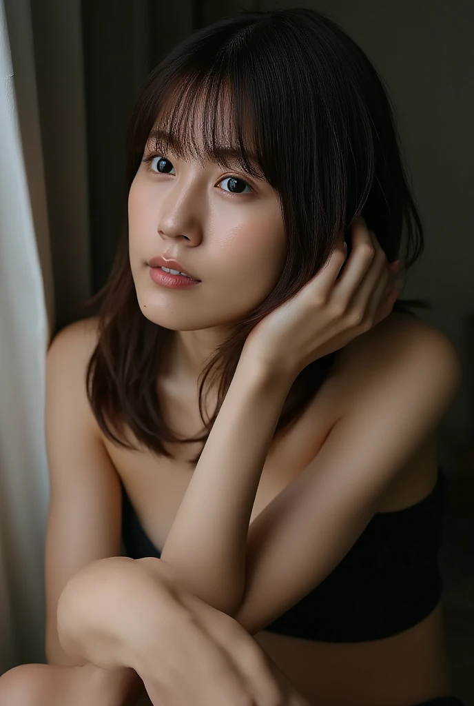 shiraishi, The image is a close-up portrait of a young Asian woman. She is looking directly at the camera with a serious expression on her face. Her hair is styled in a short bob with bangs that fall over her shoulders. She has a slight smile on her lips and her eyes are slightly squinted. The background is blurred, but it appears to be an indoor setting with a window and a plant visible. The woman is wearing a strapless black dress that is draped over her shoulder. The overall mood of the image is calm and serene.