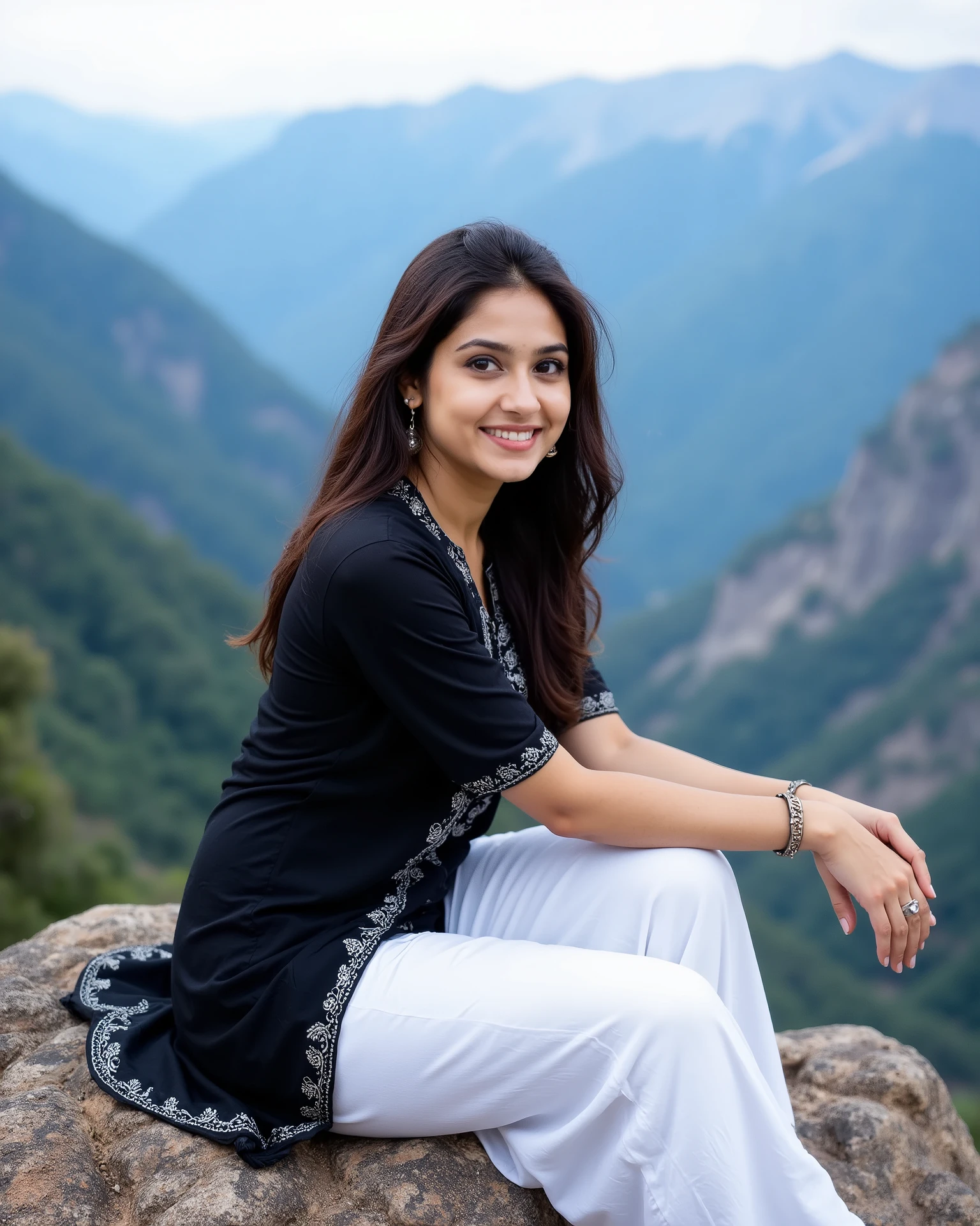 anaswarasdxl, A stunning portrait of an Indian woman perched gracefully on a rocky outcrop, overlooking a breathtaking panorama of majestic mountains. The woman, with her radiant smile, gazes directly at the viewer, her long, brown hair cascading elegantly around her shoulders. She is adorned in a stylish black kurti, intricately embroidered with white patterns, paired with pristine white pants. A delicate bangles graces her wrist, and a silver ring adds a touch of elegance to her finger. The background reveals a dramatic mountainous landscape, with one side covered in lush green vegetation and the other a barren, rocky slope. The serene blue sky, dotted with a few soft clouds, completes this picturesque scene, capturing a moment of tranquility and natural beauty.