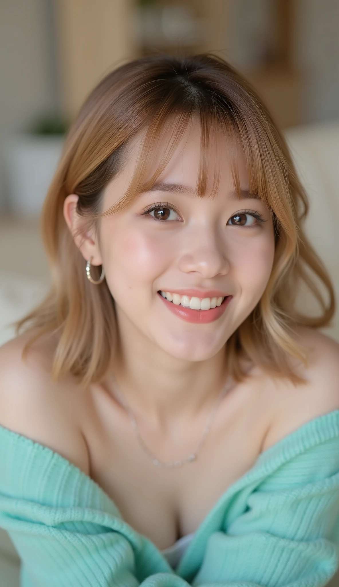 Intimate portrait of a young woman with mid-bob blonde hair and bangs, with a big smile on her face, lying flat on a cream-colored sofa, wearing an aqua off-the-shoulder sweater, shot with a Sony Alpha 7 III, 85mm lens, f/2.0 aperture, ISO 400, 1/200 sec shutter speed, low angle shot from slightly above, soft diffused lighting from overhead, shallow depth of field with blurred background, natural skin tones, subtle makeup with glossy lips, silver hoop earrings, warm and inviting mood, hyperrealistic detail, 8K resolution, professional portrait photography style, minimal post-processing with slight color correction, focus on the subject's face and expression, blurred living room background with neutral tones, soft ambient light