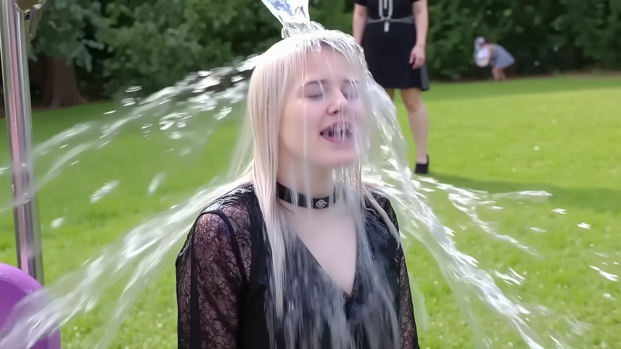 A beautiful 18-year-old goth girl with long white hair that goes all the way down to her calves. She is wearing a black lace-top peasant dress, black high heels, a black spiked choker, black lipstick, smoky eye shadow, and long black press-on false nails. She is being drenched by a massive cascade of water that is dropping in from off-screen. Her face is covered is cascading water. She is completely drenched. She is completely soaked. Drenched. Soaked. Water running down face. Water cascading over face. High speed photography. 8k. Photorealistic 1girl. Solo. Full body shot. Park setting.