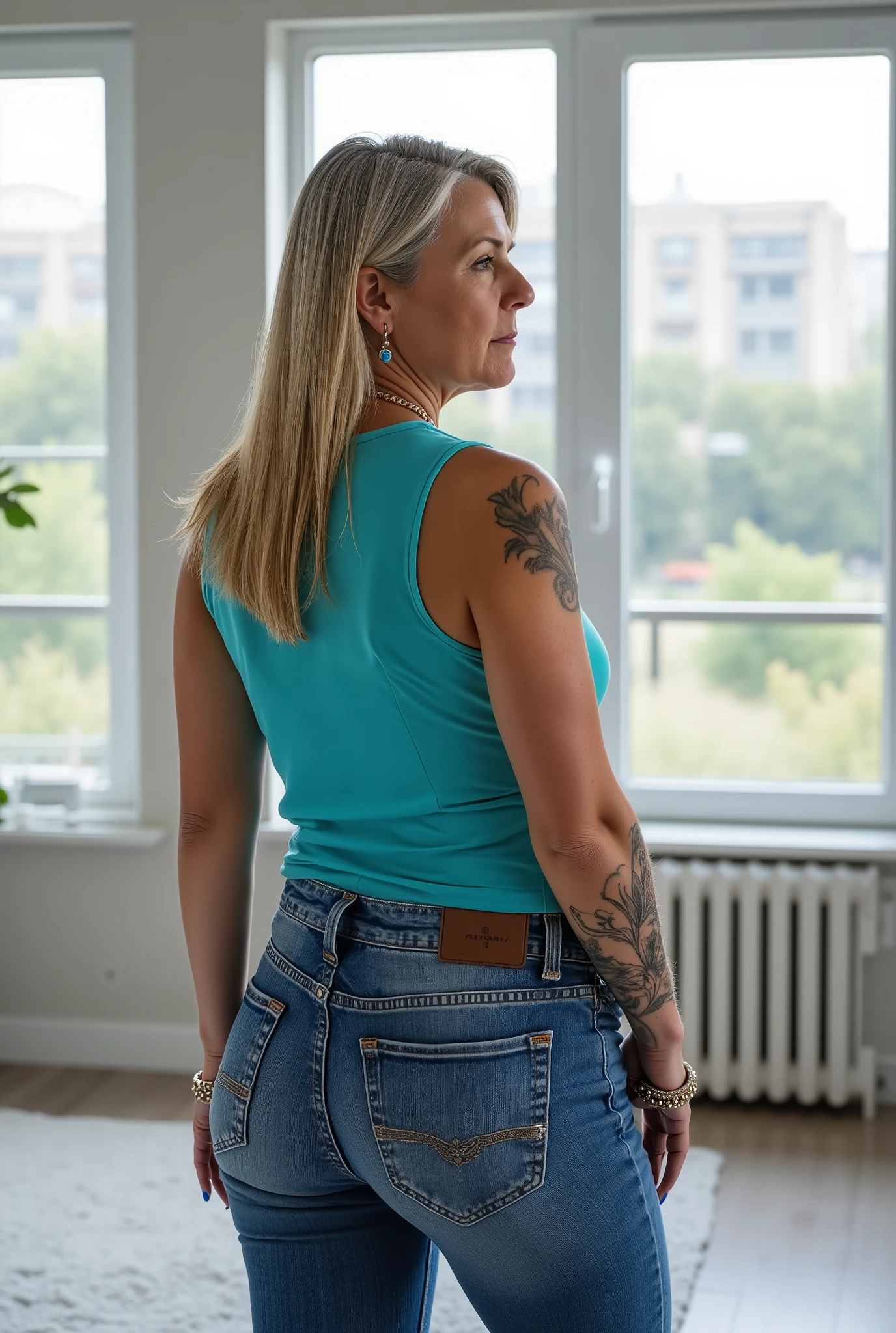 Ultra-realistic full-body rear shot portrait of a mature European woman in her late 50s, visual focus on buttocks, standing confidently in a bright modern loft with wide glass windows and soft natural daylight, facing away from the viewer. She has a naturally mature, slightly more curvy and stout body — soft, full curves around the hips, thighs, waist, and upper arms, with realistic proportions typical for her age. one hand resting lightly at her hip while the other arm falls naturally at her side, creating an elegant S-curve that emphasizes her curves. The slightly low three-quarter angle adds depth and highlights her hips and thighs, while drawing attention to the fit of her tight sexy Jeans with intricate details. Her straight, pin-straight side-parted long blonde hair falls just past her shoulders with visible grey strands. She wears a turquoise sleeveless tank top tucked into her jeans, showing small tasteful tattoos on her arms. She accessorizes with multiple bracelets, layered necklaces, several rings, and long fingernails neatly manicured and painted glossy blue. Her expression is stern, serious, and commanding, with a focused, authoritative gaze. The scene has cinematic clarity, realistic depth of field, soft natural lighting, and professional daylight color grading, highlighting natural textures, her curvy silhouette, and creating a more intriguing, dynamic composition.