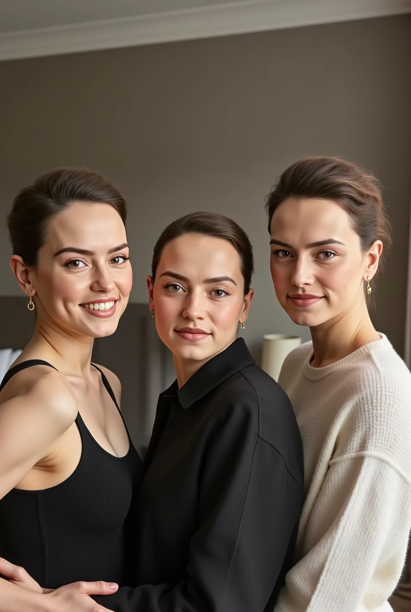 A photorealistic portrait of three women in a stylish, modern room. The woman on the left is 20 years-old. She has short brown hair and wears a black tank top. She has fair skin, brown eyes and a soft smile, directed directly at the viewer. The woman in the middle is 40 years-old. She has brown hair in a bun and wears a white sweater. She has fair skin, brown eyes and a soft smile, directed directly at the viewer. The woman is on the right is 20 years-old. She has short brown hair and wears a black tank top. She has fair skin, brown eyes and a soft smile, directed directly at the viewer. All three women stand confidently and relaxed, slightly turned towards the camera. The room is softly lit, with a bed and a curtain in the background, creating a warm and inviting atmosphere. The lighting highlights women's natural facial features and gives the scene a soft, natural appearance.
