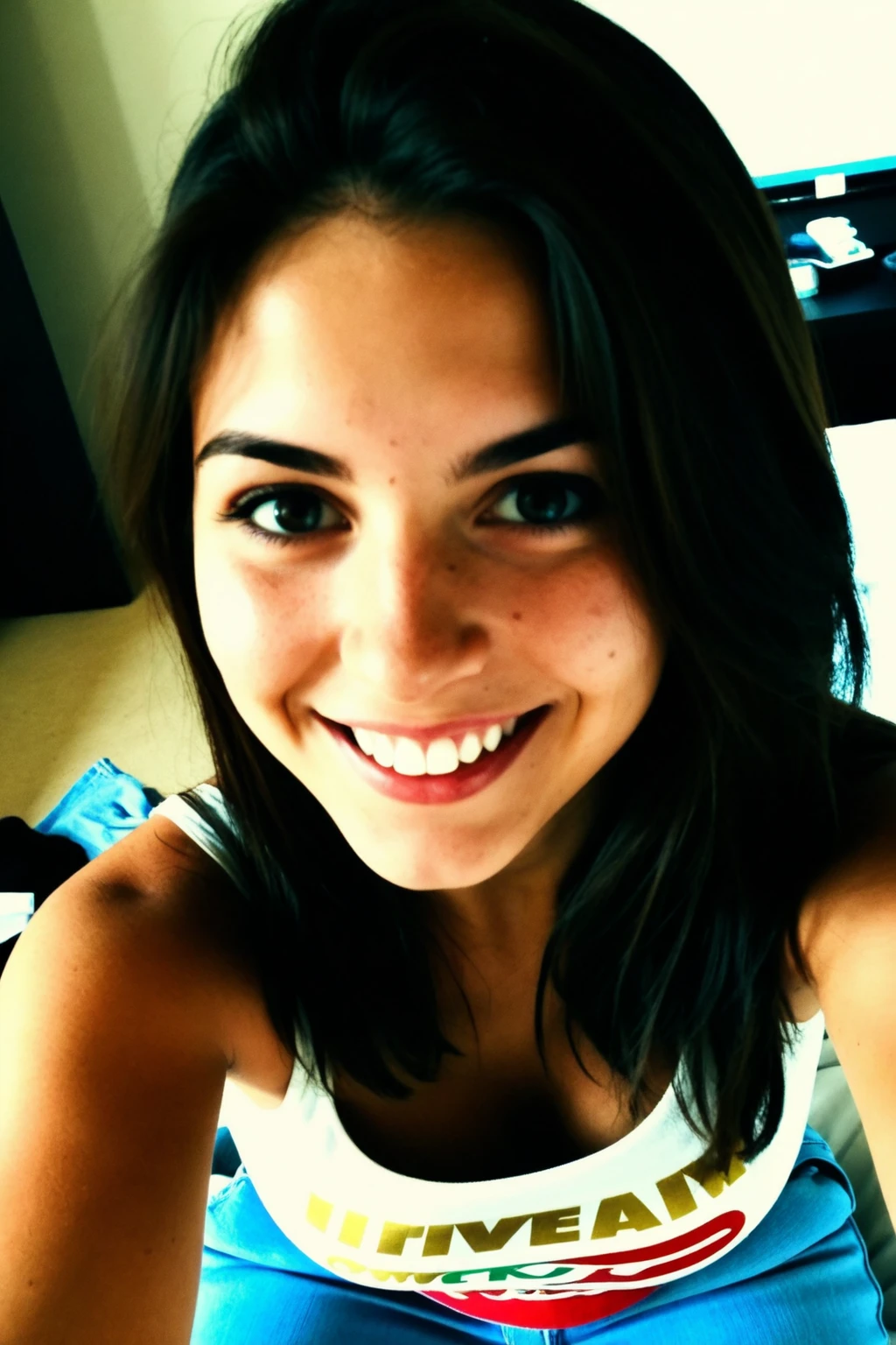 Authentic selfie photo to share, Selfie amateur, A 22-year-old Italian girl wearing jeans and a casual top. She's smiling casually, with minimal makeup, in an informal setting like her bedroom. the background shows some personal objects, film grain, film filter