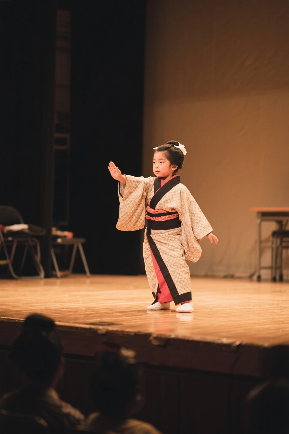 young girl in a tutu and black kimono practice to get in line, in the style of stockphoto, deutscher werkbund, selective focus, group material, shot on 70mm, whitcomb-girls, sculpted